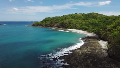 Scenic-Turquoise-Ocean-With-Lush-Trees-Costa-Rica-Beach-Coast,-4K-Drone
