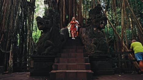 Tourists-descending-stairs-of-the-Balinese-temple-in-Bali,-Indonesia