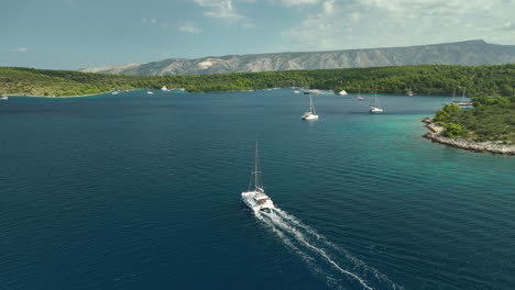 Catamaran-sailing-into-the-bays-at-Hvar-Island-on-a-sunny-day-in-Croatia