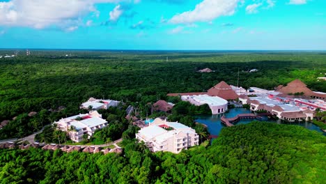 TRS-Yucatan-Resort-in-Tulum-Mexico-sliding-right-aerial-drone-shot-of-the-hotel-and-pools