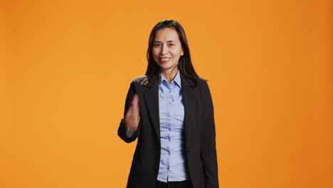 Filipino-employee-does-thumbs-up-gesture-on-camera
