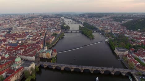 Flying-over-Vltava-river-with-Charles-Bridge-in-Prague