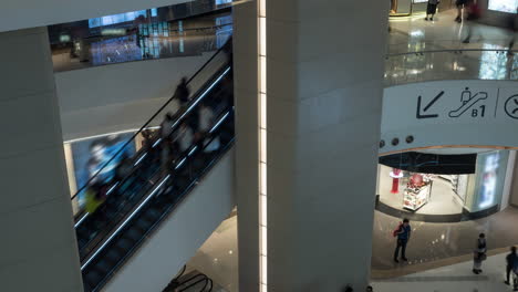 Time-lapse-view-of-people-pedestrian-traffic-on-the-escalator-in-the-big-multi-level-shopping-mall