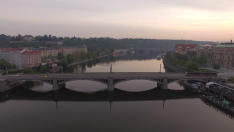 Flying-over-Manes-Bridge-across-Vltava-river-in-Prague