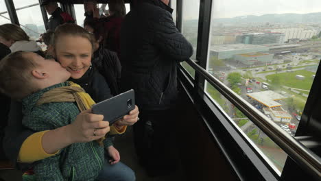 View-of-woman-with-son-in-the-cabin-of-Vienna-Giant-Wheel-Vienna-Austria