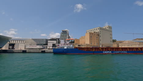 Port-harbour-of-Valletta,-Malta-with-charter-ship-and-luxury-yacht