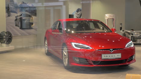 View-to-modern-electric-Tesla-car-through-the-store-window