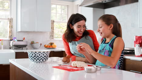 Jewish-mother-and-daughter-preparing-dough-for-challah-bread