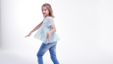 Young-Girl-Walking-And-Dancing-Across-Frame-In-Slow-Motion