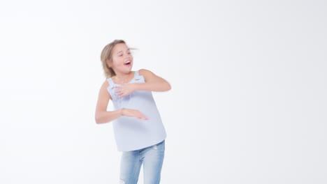 Girl-Dancing-And-Doing-Dab-Pose-Against-White-Studio-Background