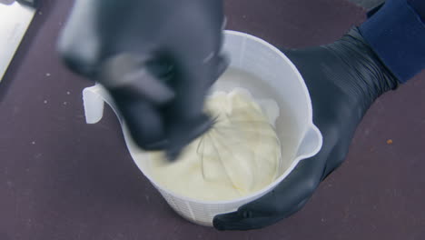 Male-Cook-Stirs-Eggs-and-Milk-in-Bowl-Using-Whisk