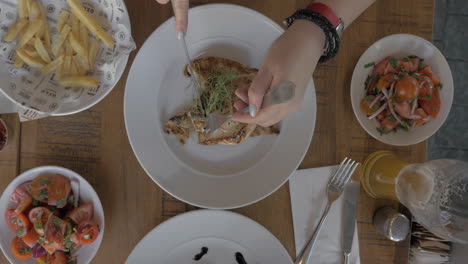 Woman-having-hearty-meal-in-cafe