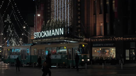 Tram-moving-in-night-street-of-Helsinki-Finland