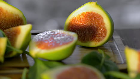 Woman-cutting-green-appetizing-figs