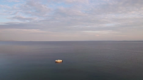 Flying-over-quiet-sea-with-single-boat