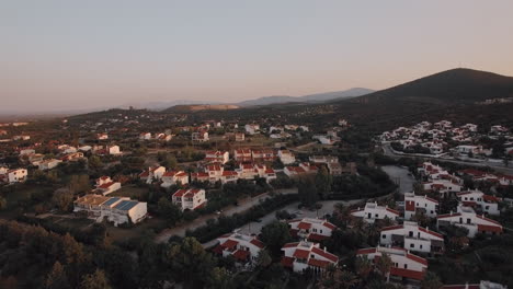 Cottages-and-hills-scene-of-Trikorfo-Beach-in-Greece-aerial