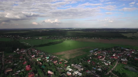 Flying-over-Russian-villages-among-green-fields-and-forests