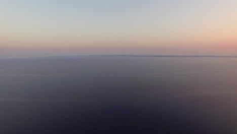 Aerial-waterscape-with-vast-sea-at-sunset