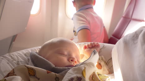 Baby-girl-sleeping-in-plane-after-breastfeeding