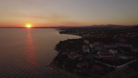 Aerial-shot-of-Greek-resort-on-sea-coast-view-at-sunset