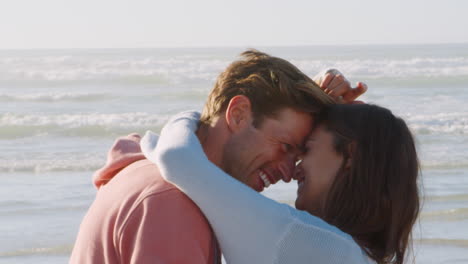 Slow-Motion-Shot-Of-Romantic-Couple-On-Winter-Beach-Vacation