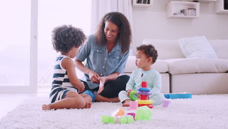 Young-black-mum-playing-with-her-daughter-and-toddler-son