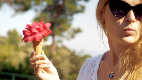Coquettish-girl-with-red-summer-bouquet-in-waffle-cone