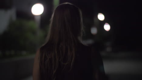 Woman-walking-alone-in-night-street