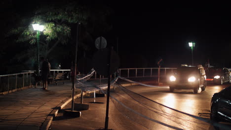 Transport-traffic-on-night-road-enclosed-with-safety-net-and-signs