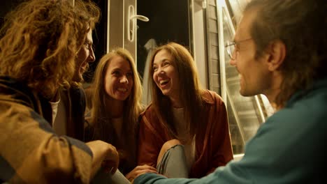 two-girls-and-two-boys-are-having-fun.-Rest-in-the-country-house