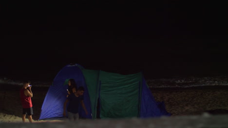 Young-people-want-to-spend-evening-in-tent-on-the-beach