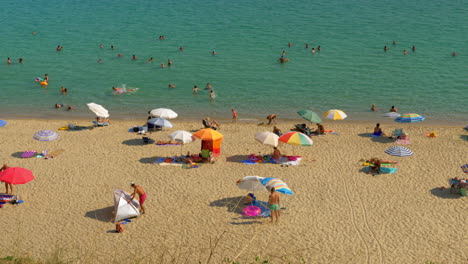 People-enjoying-summer-vacation-on-the-coast-Greece