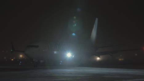 Arrival-of-Boeing-737-MAX-8-FlyDubai-at-winter-night