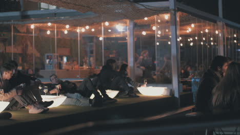 Rooftop-restaurant-with-people-in-night-Madrid-Spain