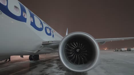 Night-view-of-Flydubai-airplane-with-boarding-bridge