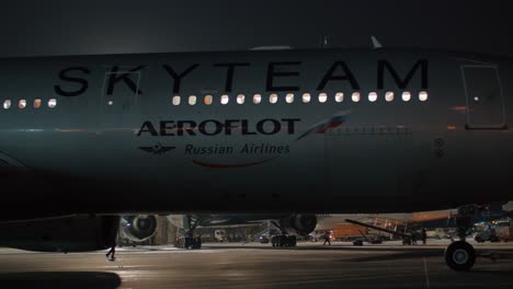 Towing-Aeroflot-aircraft-in-Sheremetyevo-Airport-at-night-Moscow-Russia