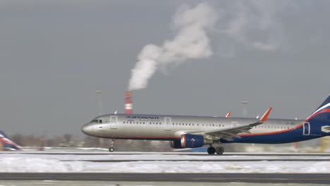 A321-jetliner-of-Aeroflot-taking-off-on-winter-day-Russia