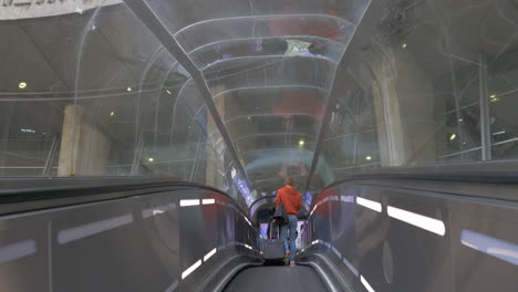 Flat-escalator-with-people-at-Charles-de-Gaulle-Airport-in-Paris-France