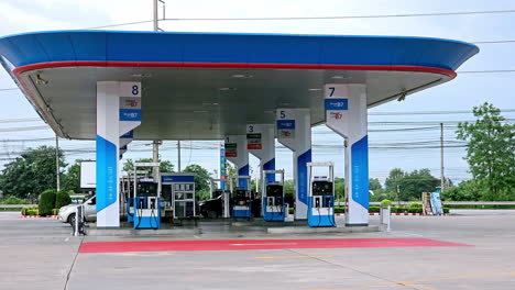 Different-kinds-of-vehicles-making-a-pit-stop-to-fill-their-tanks-with-fuel-in-a-petrol-station-by-the-roadside-in-Thailand