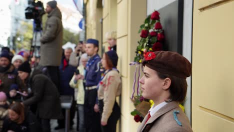 A-girl-scout-standing-by-the-memorial