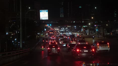 Taken-from-windshield-of-a-car-reveals-a-heavy-traffic-in-Bangkok-during-an-extended-rush-hours-in-Bangkok,-Thailand