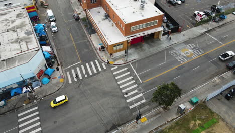 Aerial-view-of-traffic-and-homeless-tents-in-front-of-the-LAFD-Fire-Station-9,-in-Skid-Row,-LA