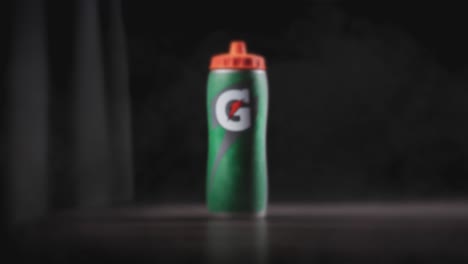 Gatorade-Sports-Drink-Original-Bottle-green-G-with-orange-tip-classic-professional-athlete-sideline-hydration-isolated-cinematic-reveal-presentation-display-fitness-h20-editorial-use