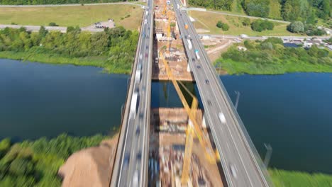 Aerial-hyperlapse-of-vast-A1-bridge-construction-site-in-Kaunas