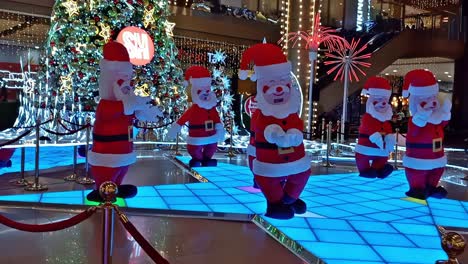 Editorial-illustrative-video-of-a-typical-rendition-of-the-dancing-Santa-theme-decor-on-display-at-the-lobby-of-SM-City-Cebu,-a-large-Philippine-mall