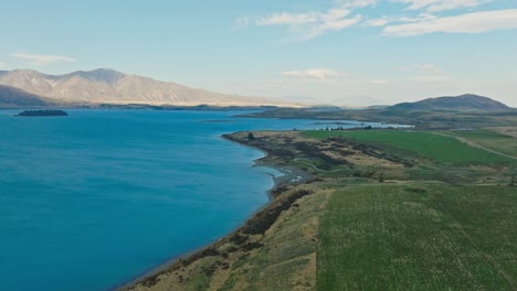Stunning-aerial-view-of-Lake-Tekapo-with-pristine-turquoise-water-in-Mackenzie-Basin-of-Canterbury,-New-Zealand-Aotearoa