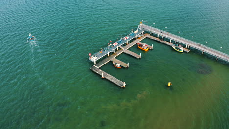 Aerial-view-above-the-pier-in-Mechelinki,-Poland