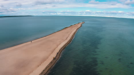 Aerial-view-of-drone-flying-above-the-headland-towards-the-baltic-sea-in-Rewa,-Poland