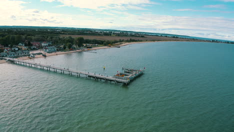 Panoramic-view-of-a-pier-in-Mechelinki,-Poland-with-Baltic-sea-in-the-background