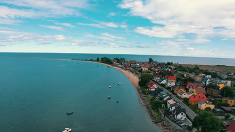 Drone-flying-above-Rewa-in-Poland-with-baltic-sea-in-the-backgrdound
